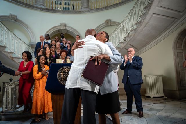 New York City Mayor Eric Adams and New York Council Speaker Eric Adams embrace each other at a press conference announcing a budget deal.